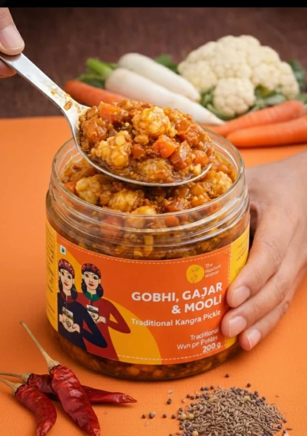 gajar gobhi mooli pickle closeup spoon